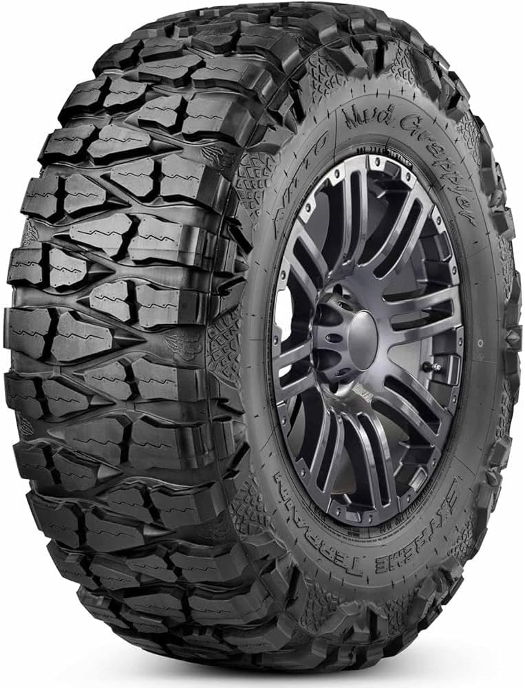 Nitto Mud Grappler mud-terrain tire, wide voids between tall tread blocks and lugged sidewall detail